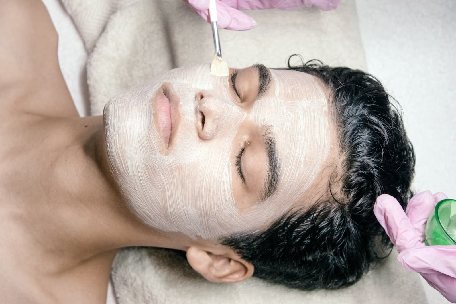 Deep cleanse facial treatment being applied to clear congested skin in Cheltenham, treatment in progress
