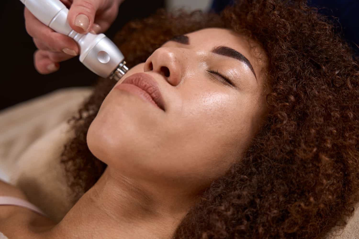 Diamond microdermabrasion facial treatment being performed in Cheltenham, close up